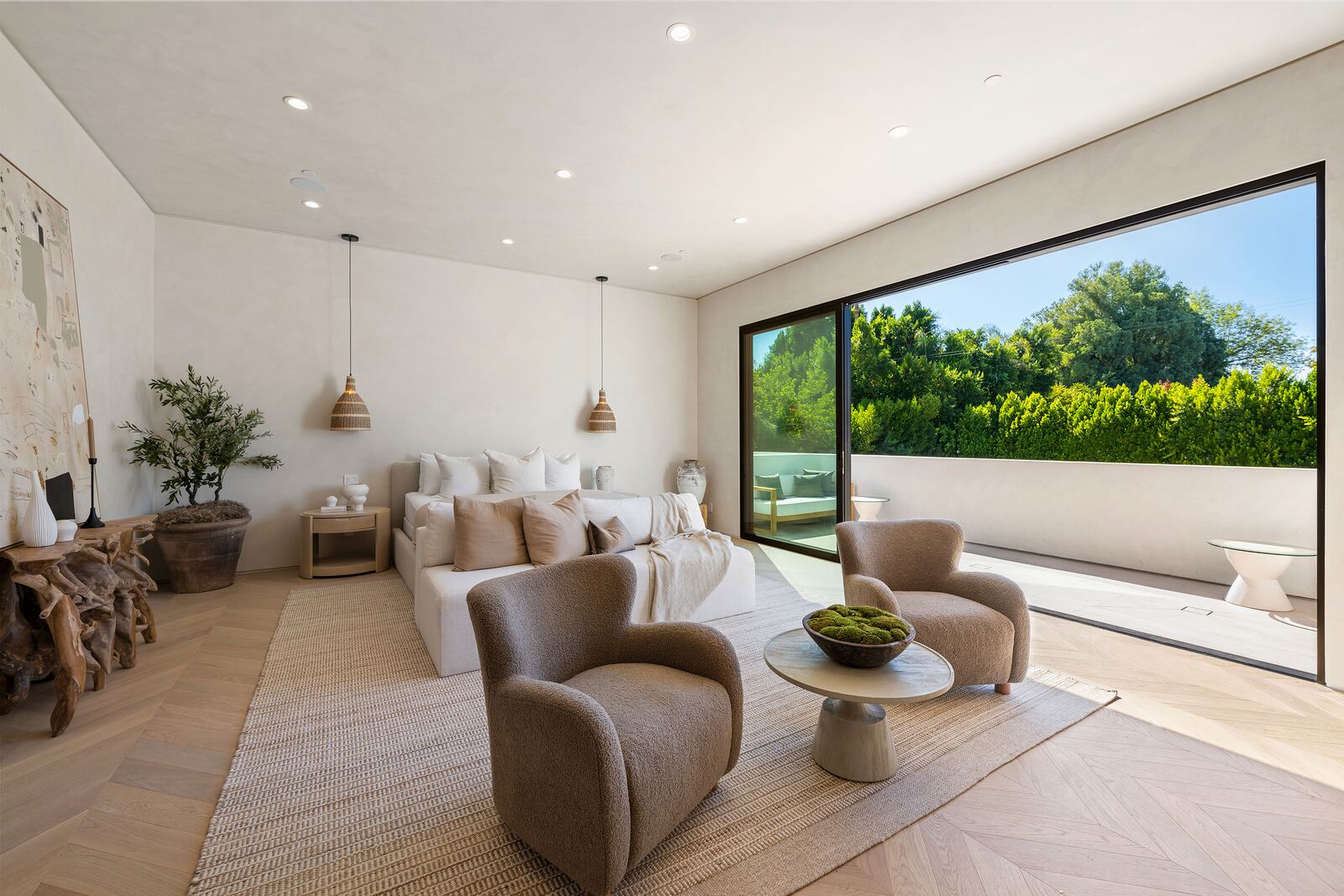 Los Angeles living room with lounge chairs and wide sliding glass doors